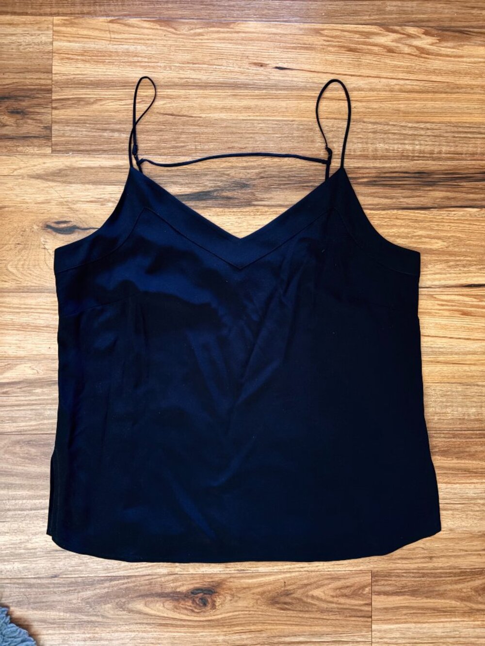 Sleek Black Satin V-neck Camisole with Adjustable Straps.